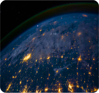 Earth from space at night, city lights glowing